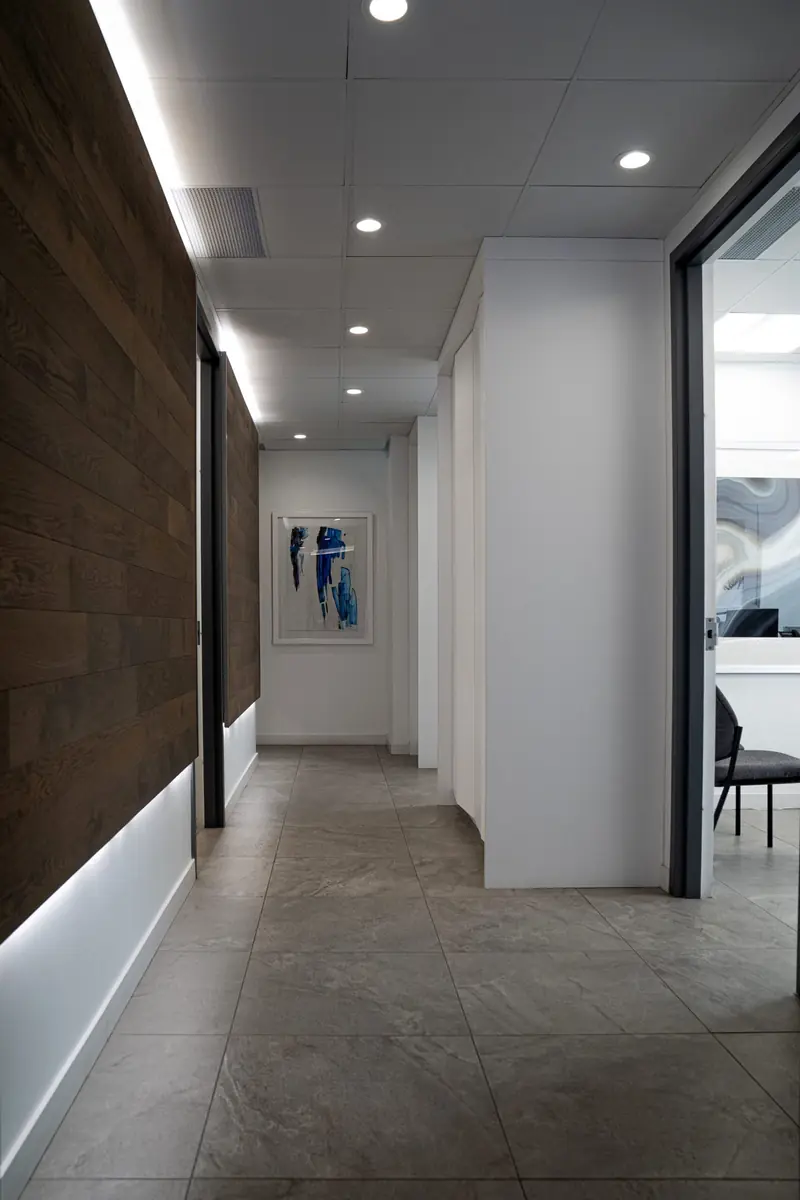 The walnut-panelled hallway leading to the consultation rooms