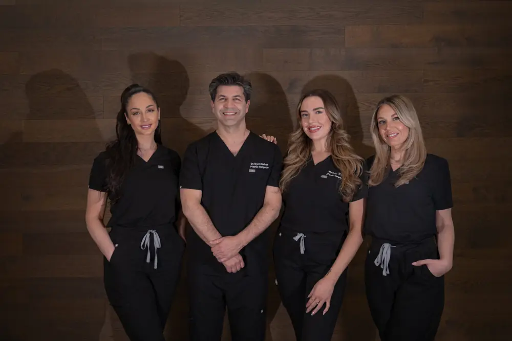 Dr. Beber's team standing together in the clinic